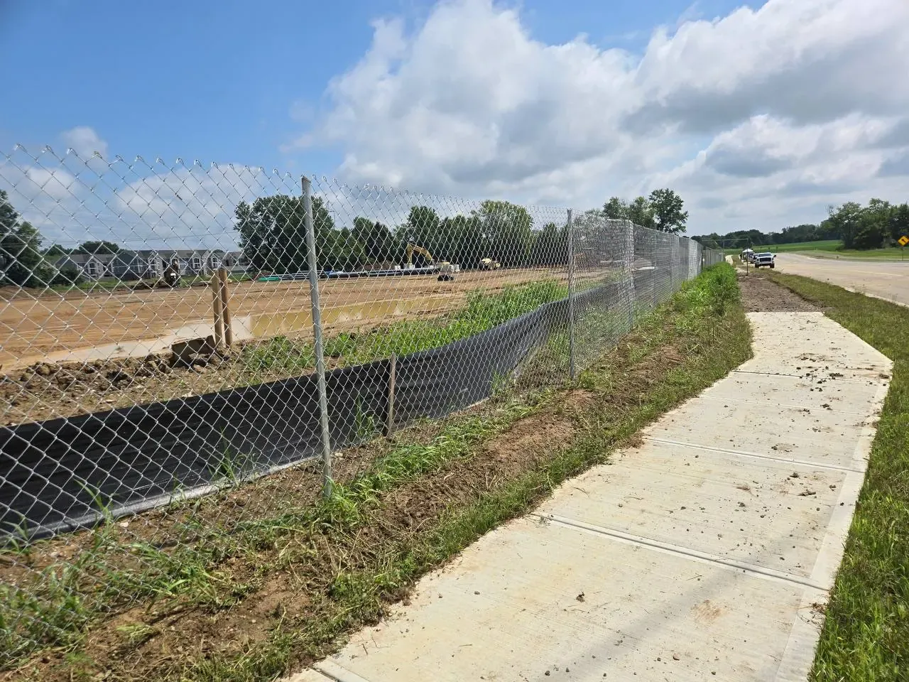 Construction site enclosure with secure access control — Midway Rent-A-Fence